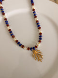 Vibrant multicolored glass beaded necklace for women, perfect for a coastal girl summer beach aesthetic.