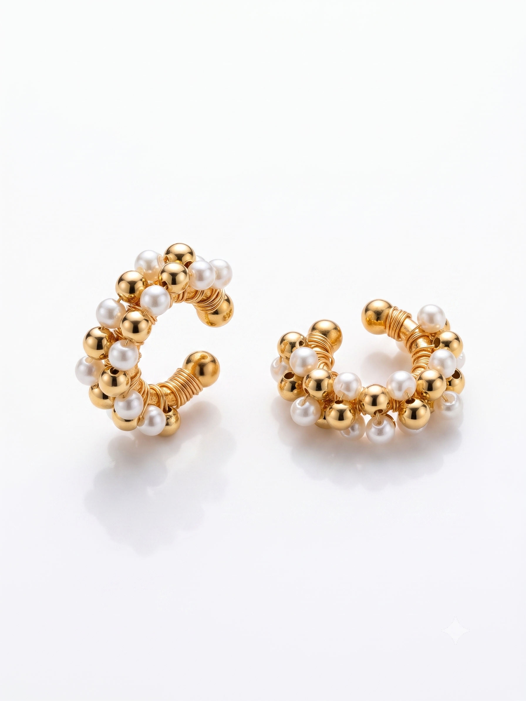 an image showcasing a pair of beaded earcuffs from Showy LLC
