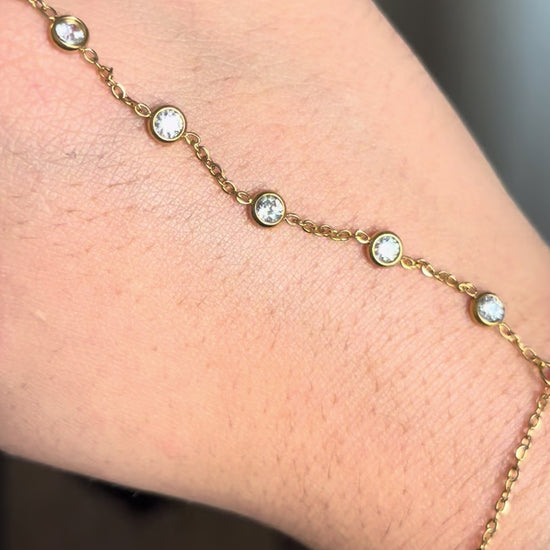 Hand chain bracelet golden with rhinestones