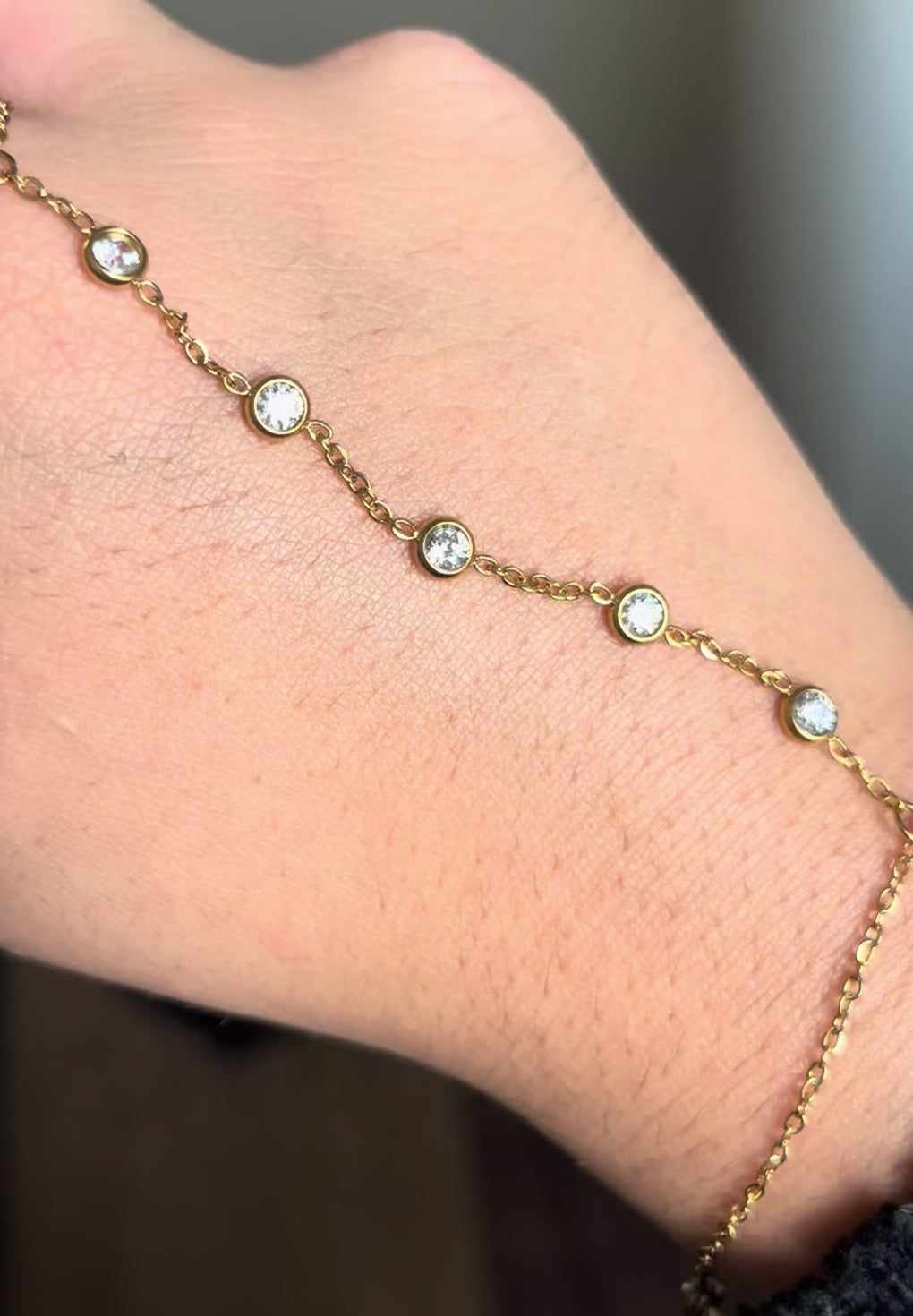 Hand chain bracelet golden with rhinestones